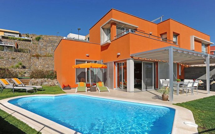 Modern villa with private pool and views of the golf course in the