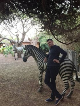 Brendan chills with the resort zebra