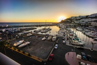 Watch the sun set at the marina in Puerto Rico in Gran Canaria, Canary Islands