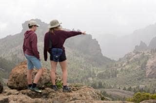 Will Gray's children Joe and Ellie looking out across the view from Roque Nublo in the centre of Gran Canaria